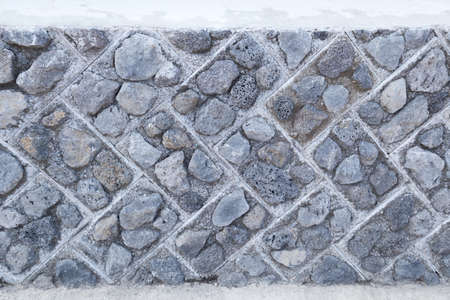 Stone wall texture background.Texture of a Square pattern stone wall.