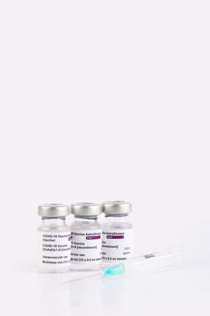 San Sebastian, Gipuzkoa, Spain; 03 February 2021. Three Covid-19 vaccine vials with white background...
