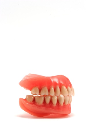Dentures in profile on a white background