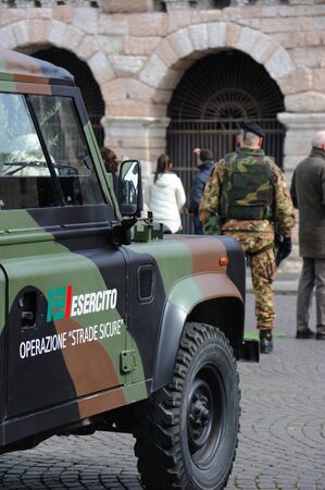 Verona, Italy - March 13, 2016: Military truck in front Verona Arena with military guard, as part of"Safe Roads' Operations for the prevention of terrorist attacksのeditorial素材
