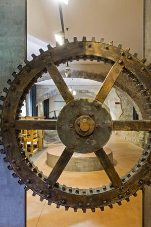 31 August 2019 - Paper Valley, Toscolano Maderno (BS) Italy, Paper Museum, old gear wheelのeditorial素材