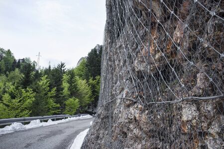rockfall protection nets, installed to protect an rock wallの写真素材