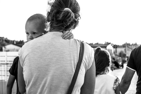 look of a child in the arms of the motherのeditorial素材