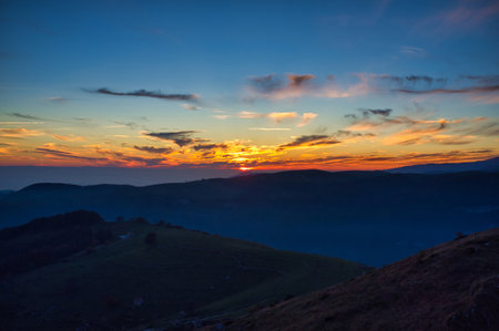 Dark and vivid sunset in the mountains
