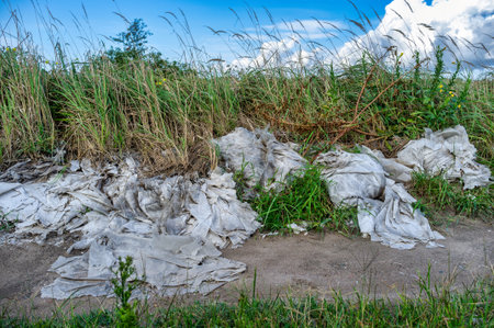 Plastic sheets in decay, abandoned in the countryside