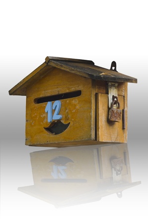 old wood mailbox with isolated white backgroundの写真素材