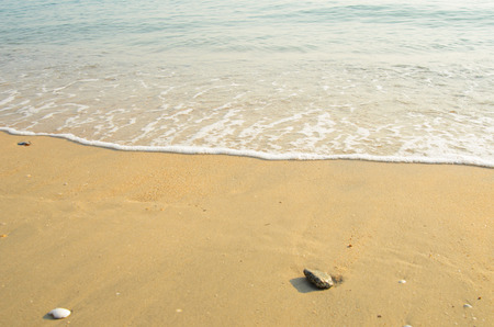 Sand beach background against sea and sky