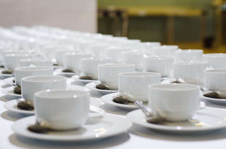 Coffee cup and saucer on a wooden table.の写真素材