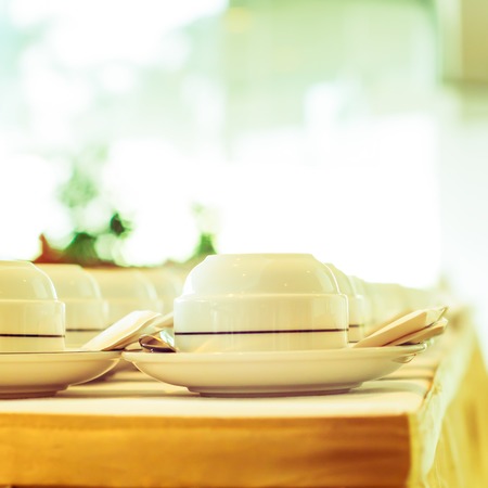 Preparing cup of coffee on the table in vintageの写真素材