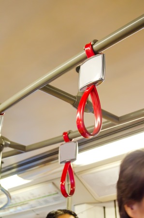 Handles for standing passenger in electric trainの写真素材