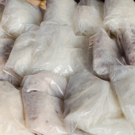 Sticky rice pack in plastic wrap preparing for eatの写真素材