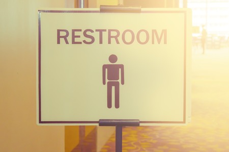 Toilets icon, Public restroom signs with a man symbol and blur vintage filter.の写真素材