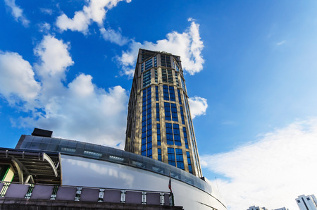 Modern office buildings in central of Thailand ant eye view with blue sky and cloud.