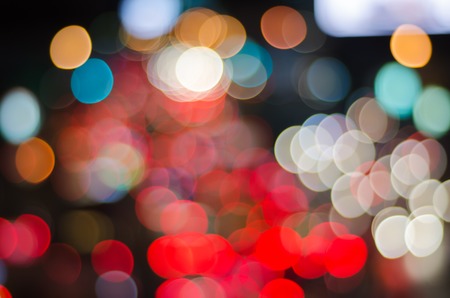 Night traffic and lights bokeh of car on road in city