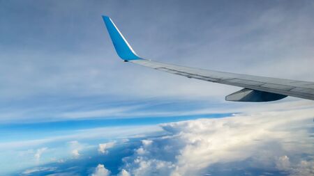 Clouds and sky seen through window of an aircraftのeditorial素材