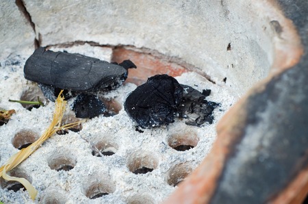 Black charcoal in old stove, thai traditionalの写真素材