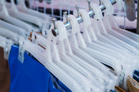 Clothes on hanger in shop, Sale background theme.