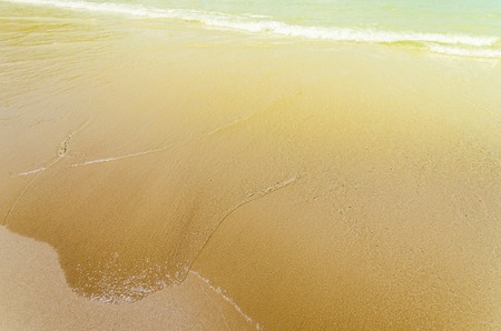 Sand beach background with a soft light filter and blank space purpose