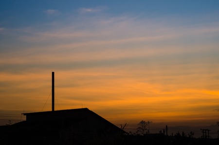 Manufacturing plant with sunset landscape in the industrial parkの写真素材