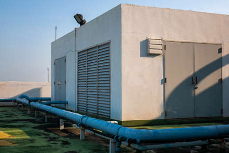 Control room on deck top of industrial building with soft warm light in morning