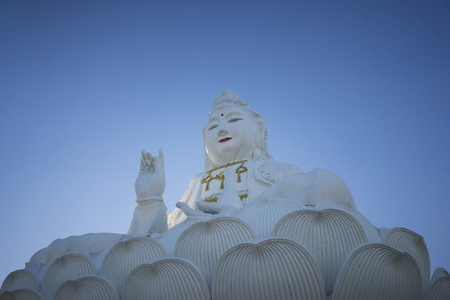 Sitting statue of The Goddess of Compassion and Mercy, Guanyin at Wat Huai Pla Kha in Chiang Rai,Thailandの写真素材