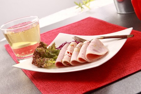 Ham, vegetables and beverages. の写真素材
