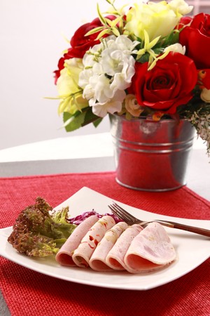Ham, vegetables and beverages. の写真素材