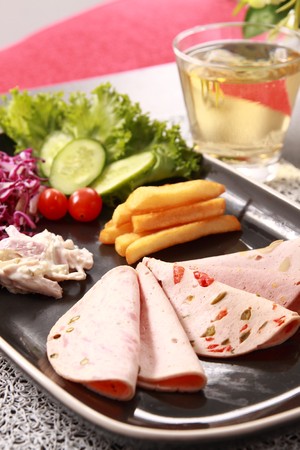 Ham, vegetables and beverages. の写真素材