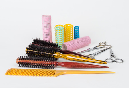 Hair dryer, straighteners and comb brush, isolated on whiteの写真素材