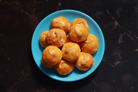 Cashew cookie platter blue black backgroundの写真素材