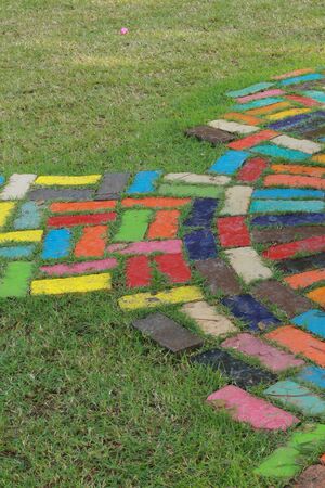 Floor tiles on green grassの写真素材