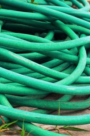 Hose green pile on the floor.の写真素材