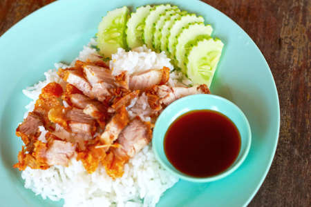 Crispy roasted belly pork chinese style and riceの写真素材