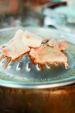 Pig roasting pan on the stove.の写真素材