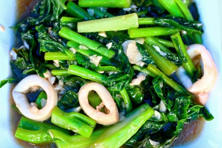 Stir fried kale with fresh squid - chinese foodの写真素材