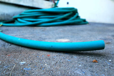 Hose green pile on the floor の写真素材