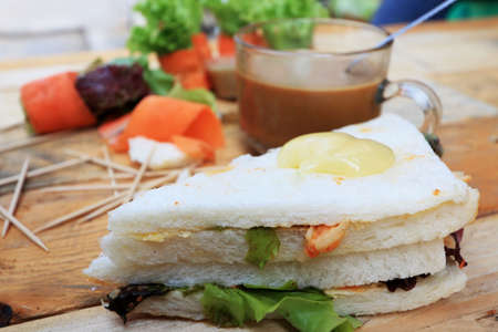 Tuna sandwich with salad vegetables and coffeeの写真素材