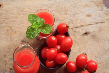 Fresh tomatoes and juiceの写真素材