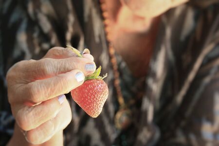 adult women and strawberryの写真素材