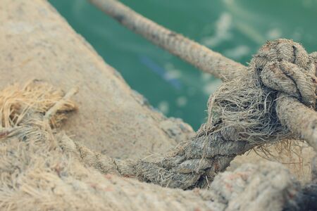 Boats tied at ropeの写真素材