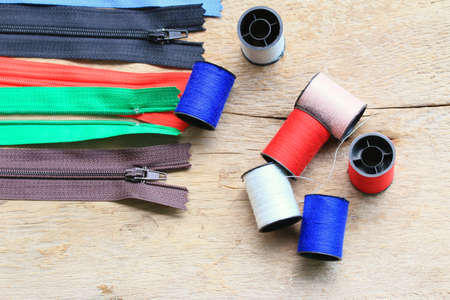 thread spool and zipperの写真素材