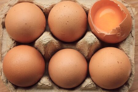 brown egg in boxの写真素材