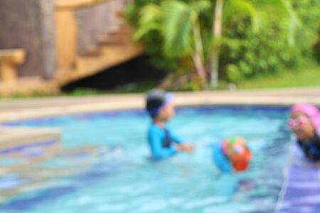 blurred kid swimming poolの写真素材