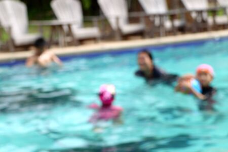 blurred kid swimming poolの写真素材