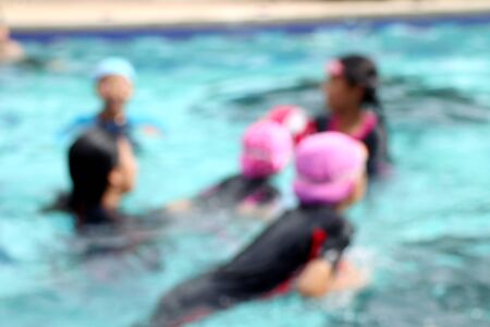 blurred kid swimming poolの写真素材
