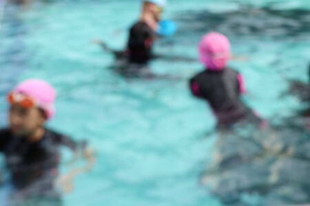 blurred kid swimming poolの写真素材