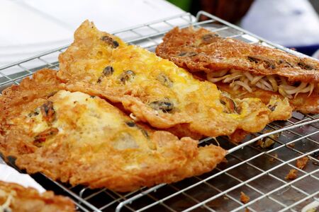 Crispy fried mussels with eggの写真素材