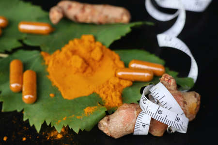 Turmeric capsule with powderの写真素材
