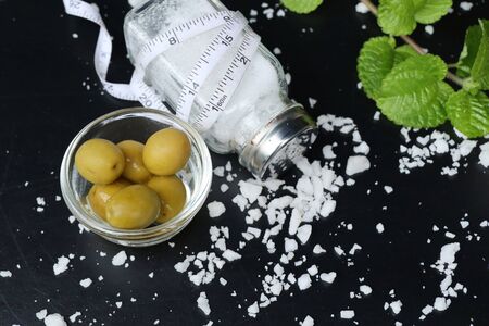 Organic green olives with saltの写真素材