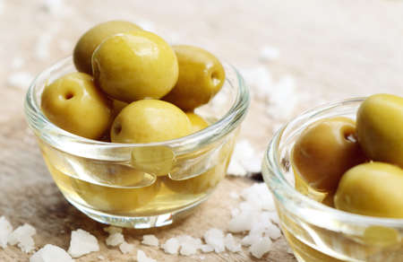 Organic green olives with saltの写真素材